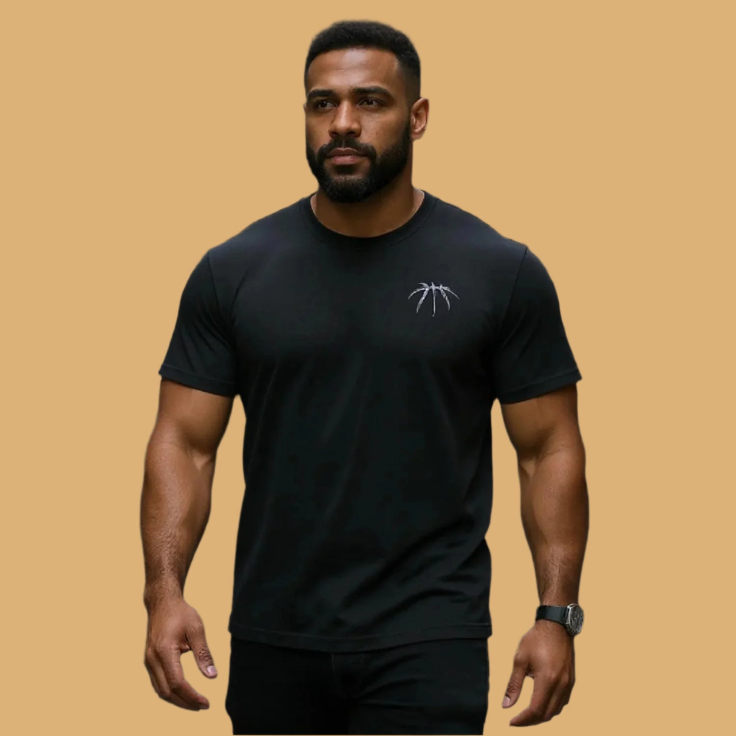 Man wearing a black t-shirt with a logo on a beige background