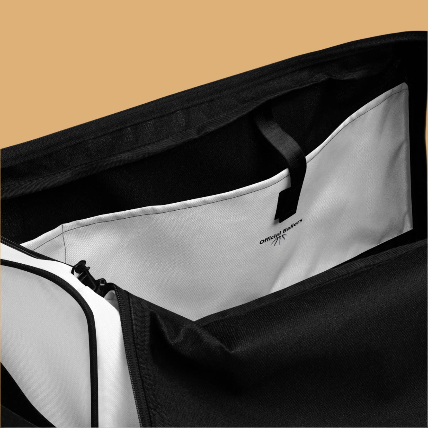 Close-up of a black and white bag with a visible brand logo on a white background