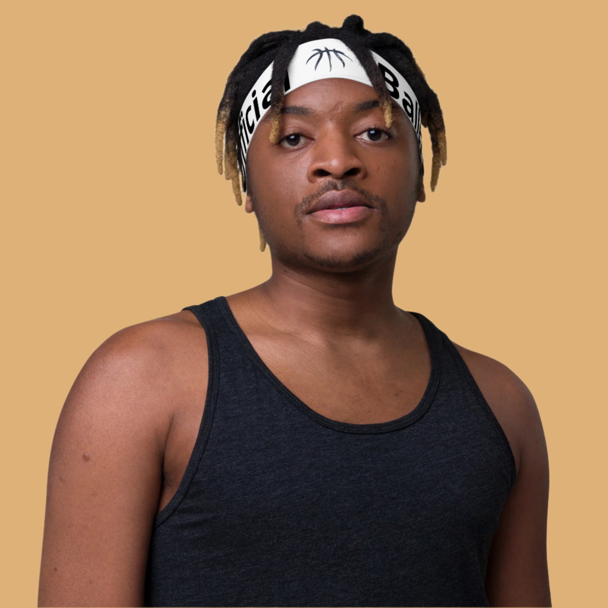 Person wearing a black tank top and headband with visible branding on a white background