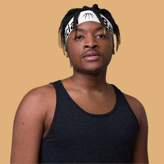 Person wearing a black tank top and headband with visible branding on a white background