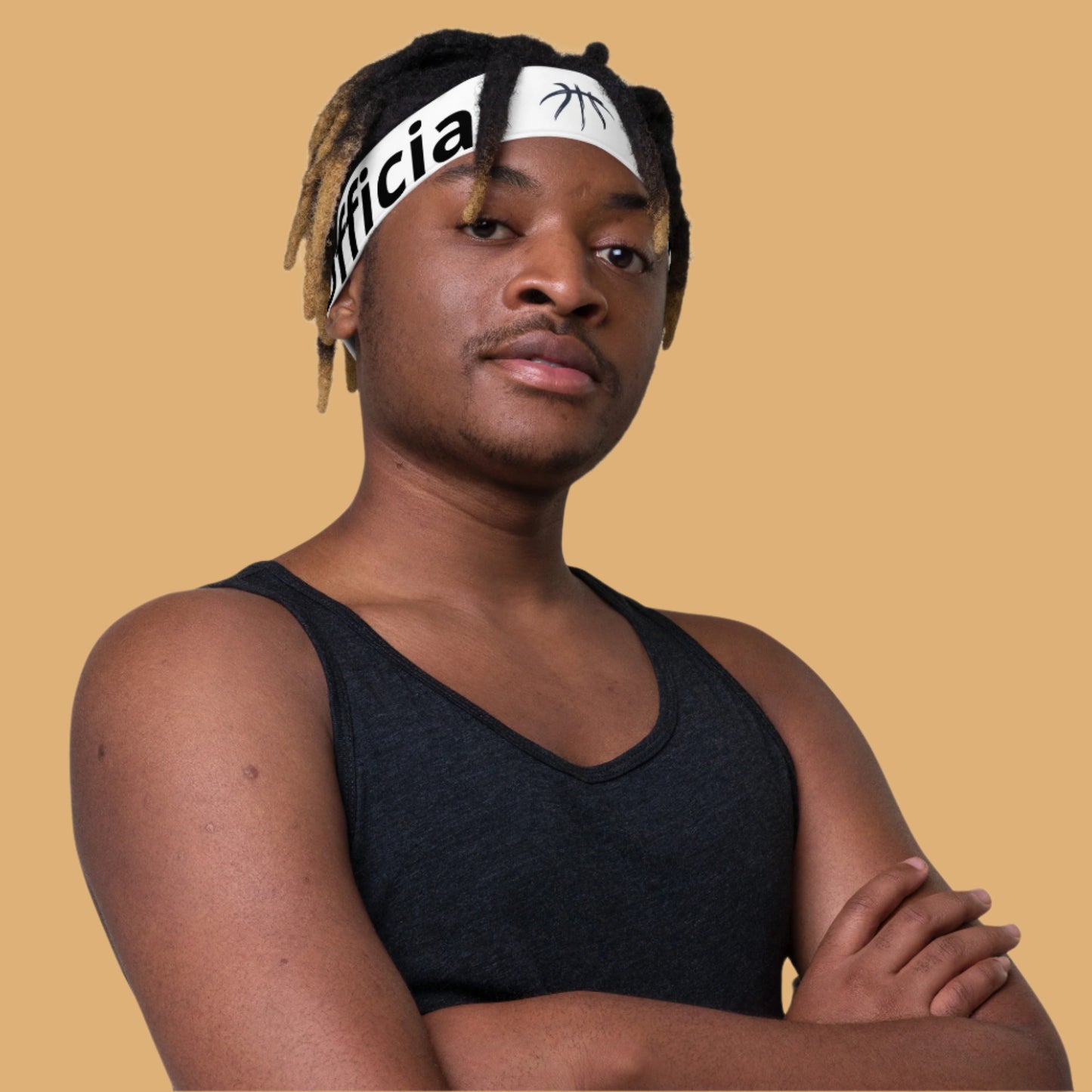 Person wearing a black tank top and a headband with text on a white background