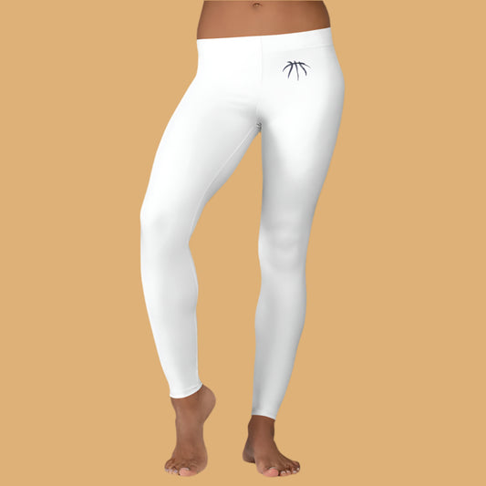White leggings with a logo worn by a person standing against a gray background with a plant.