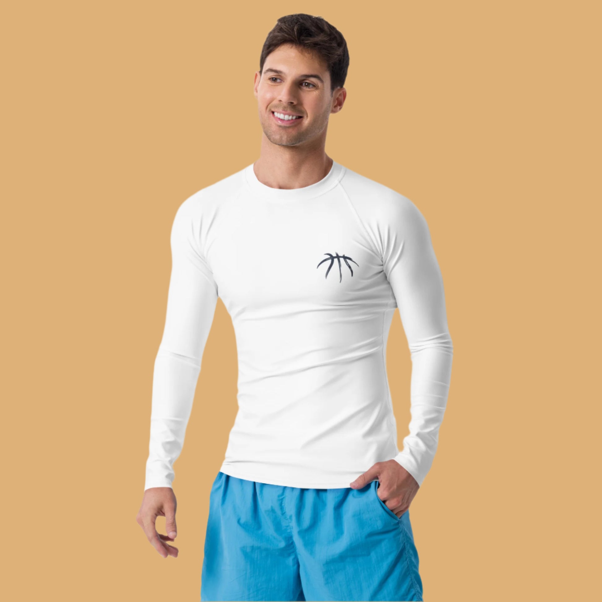 Man wearing a white long-sleeve shirt with a logo and blue shorts on a white background