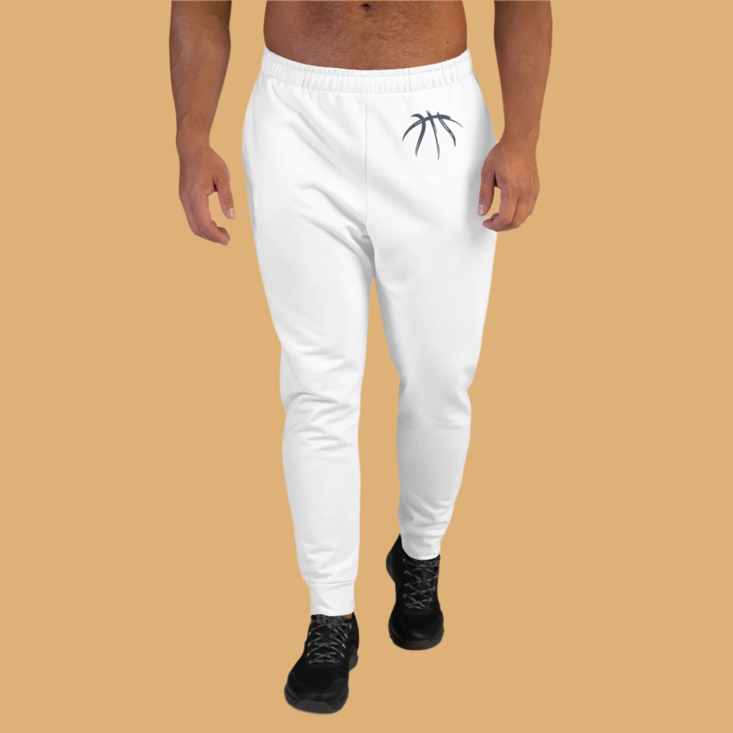 White sweatpants with a black logo worn by a person on a beige background