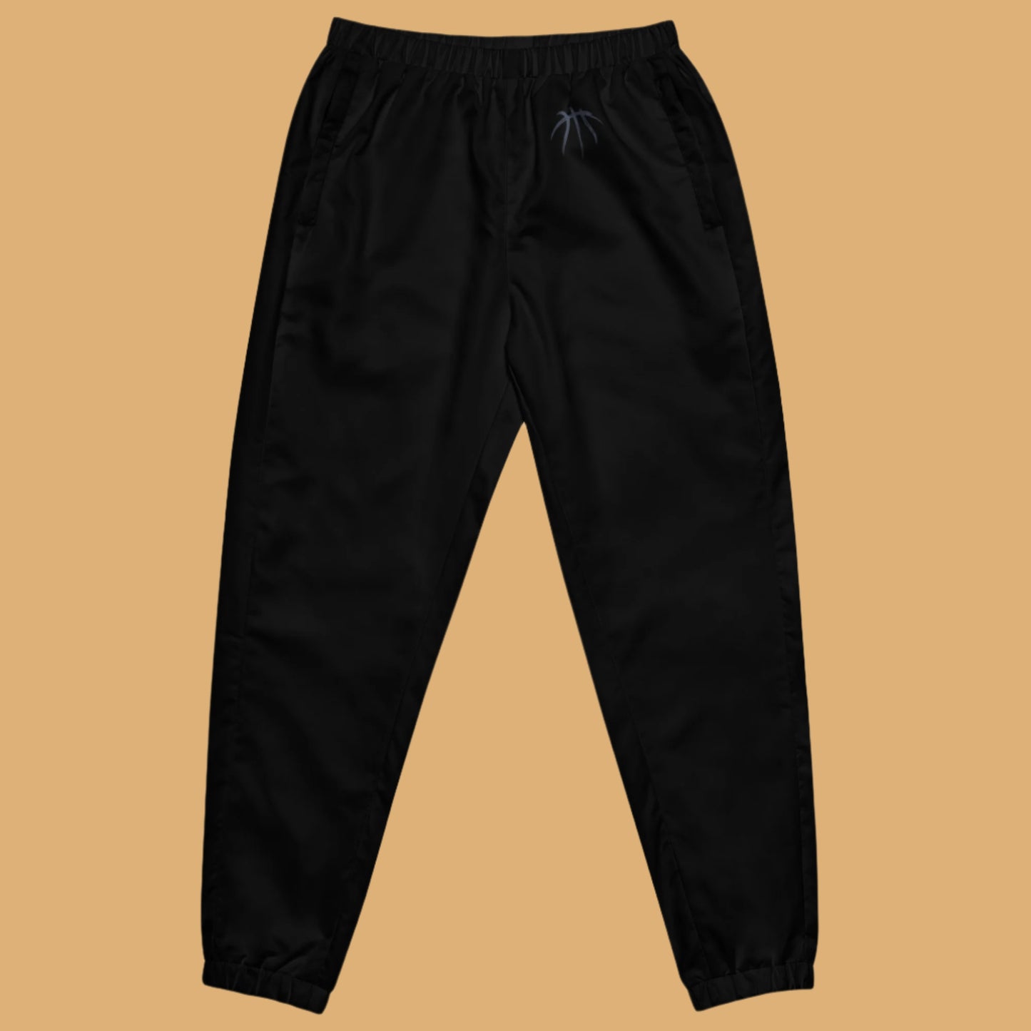 Black pants on a beige background