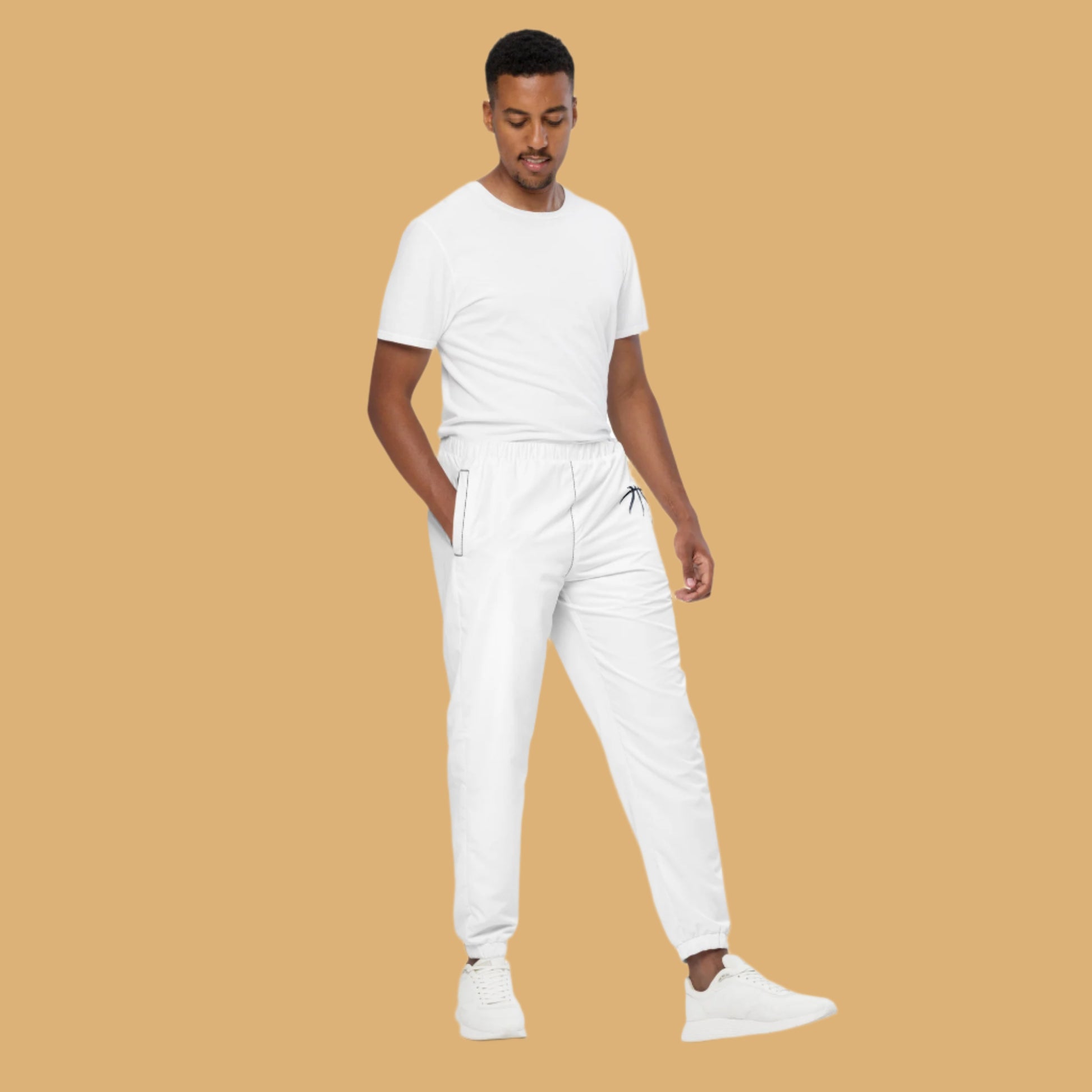 Man wearing a white t-shirt and pants on a beige background