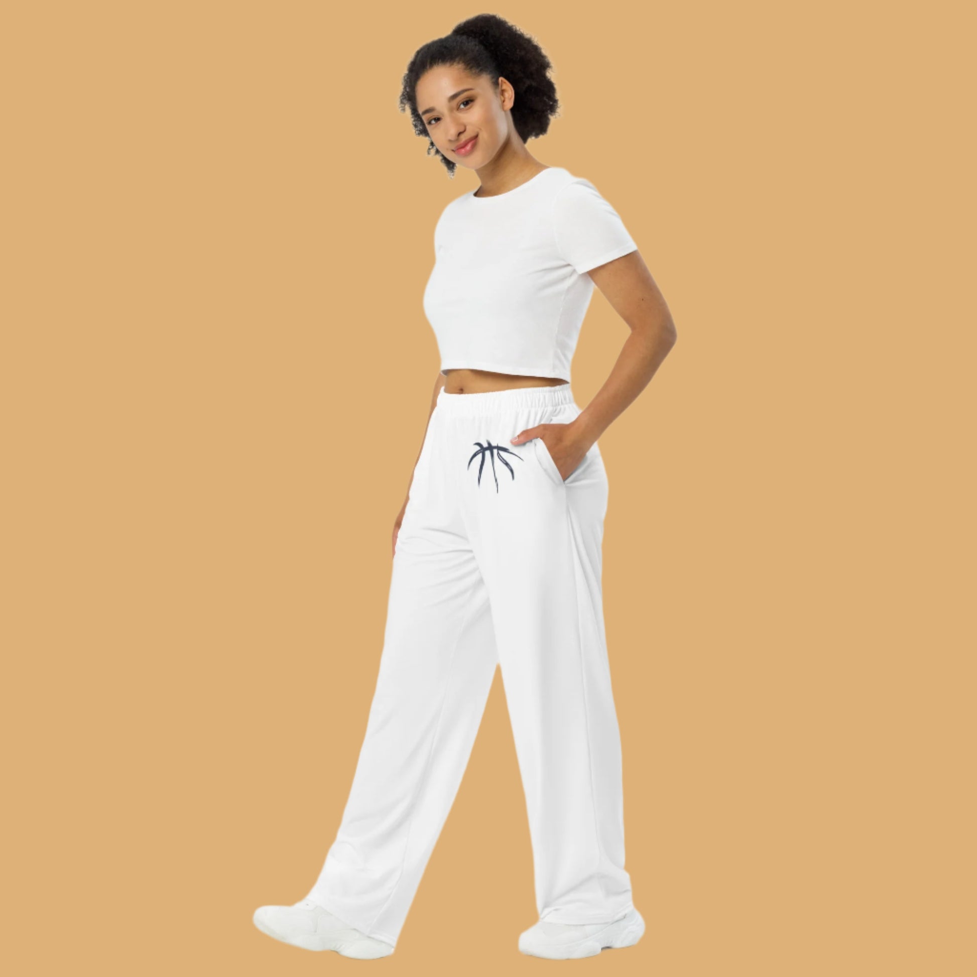 Woman wearing a white outfit with a logo on a white background