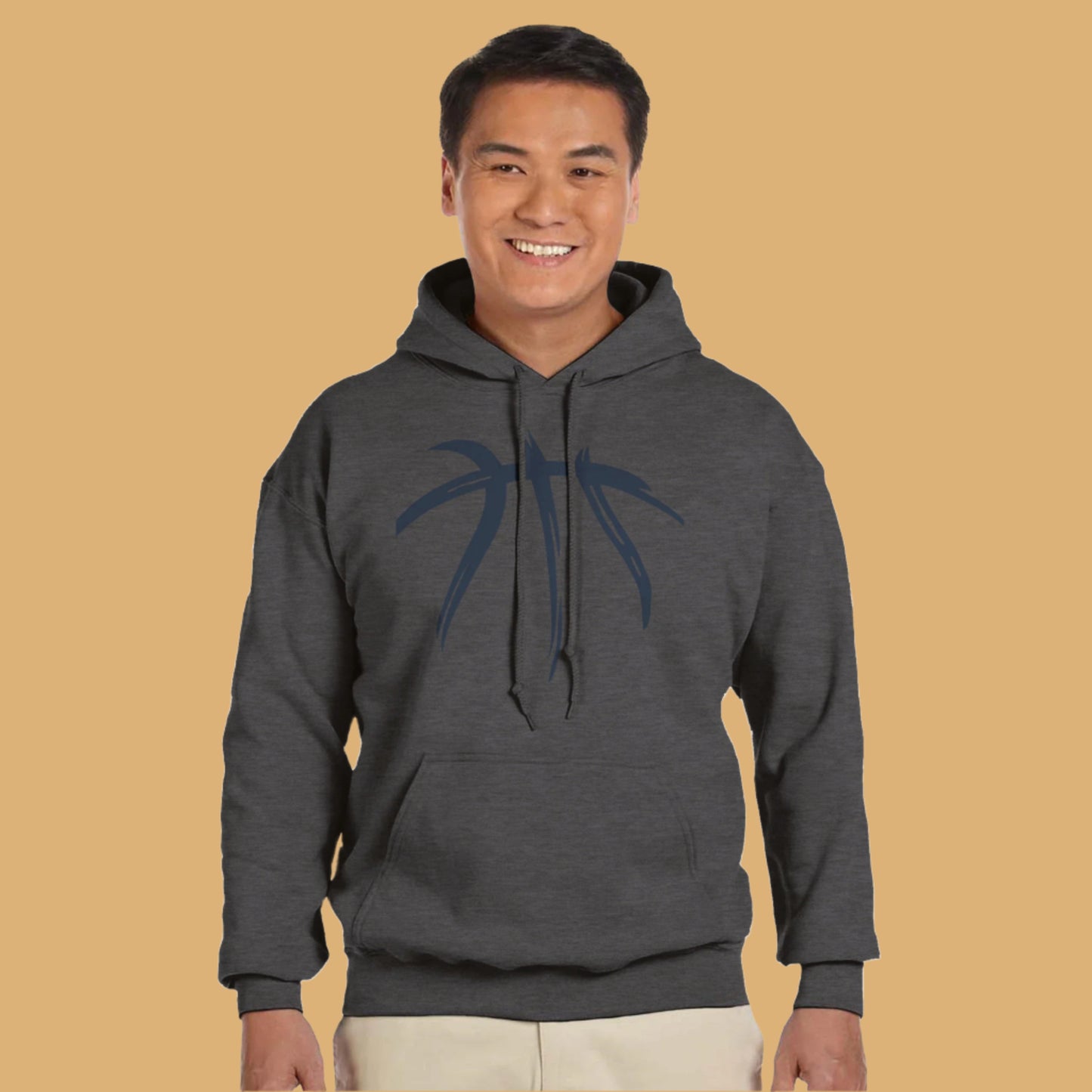 Man wearing a dark gray hoodie with a blue graphic on a white background