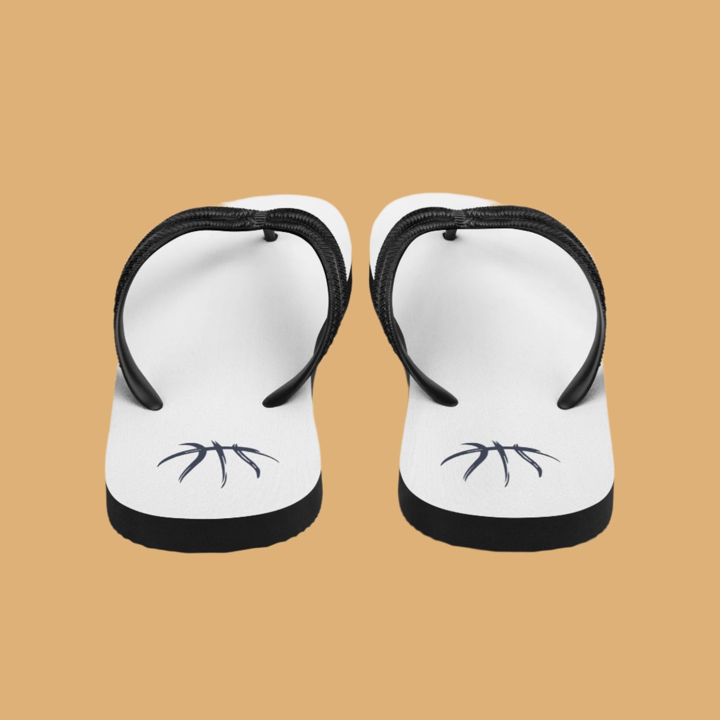 Pair of white flip-flops with black straps on a white background