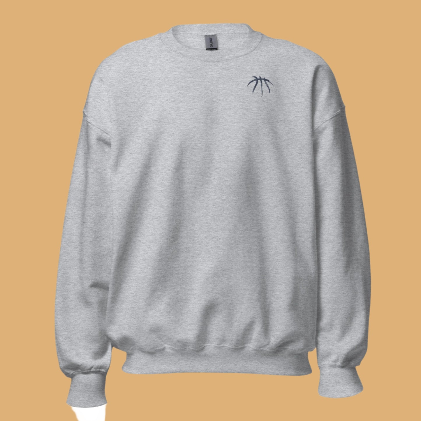 Gray sweatshirt with a small black logo on a beige background