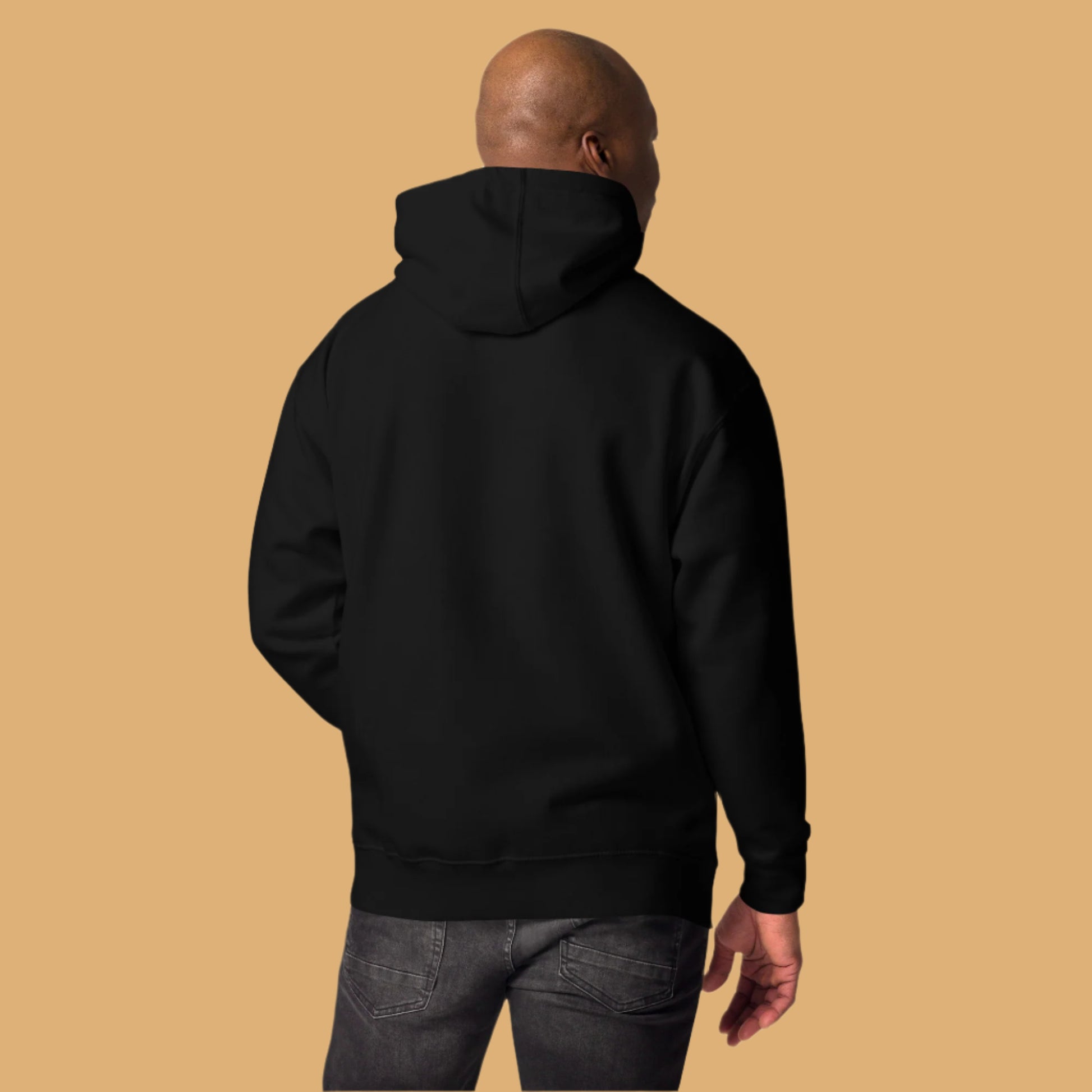 Person wearing a black hoodie from behind on a white background