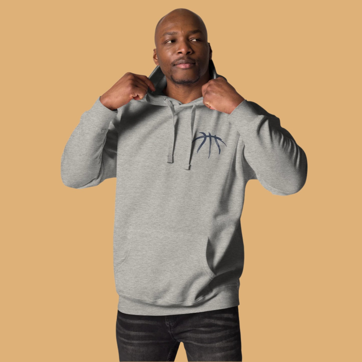Man wearing a gray hoodie with a logo on a white background