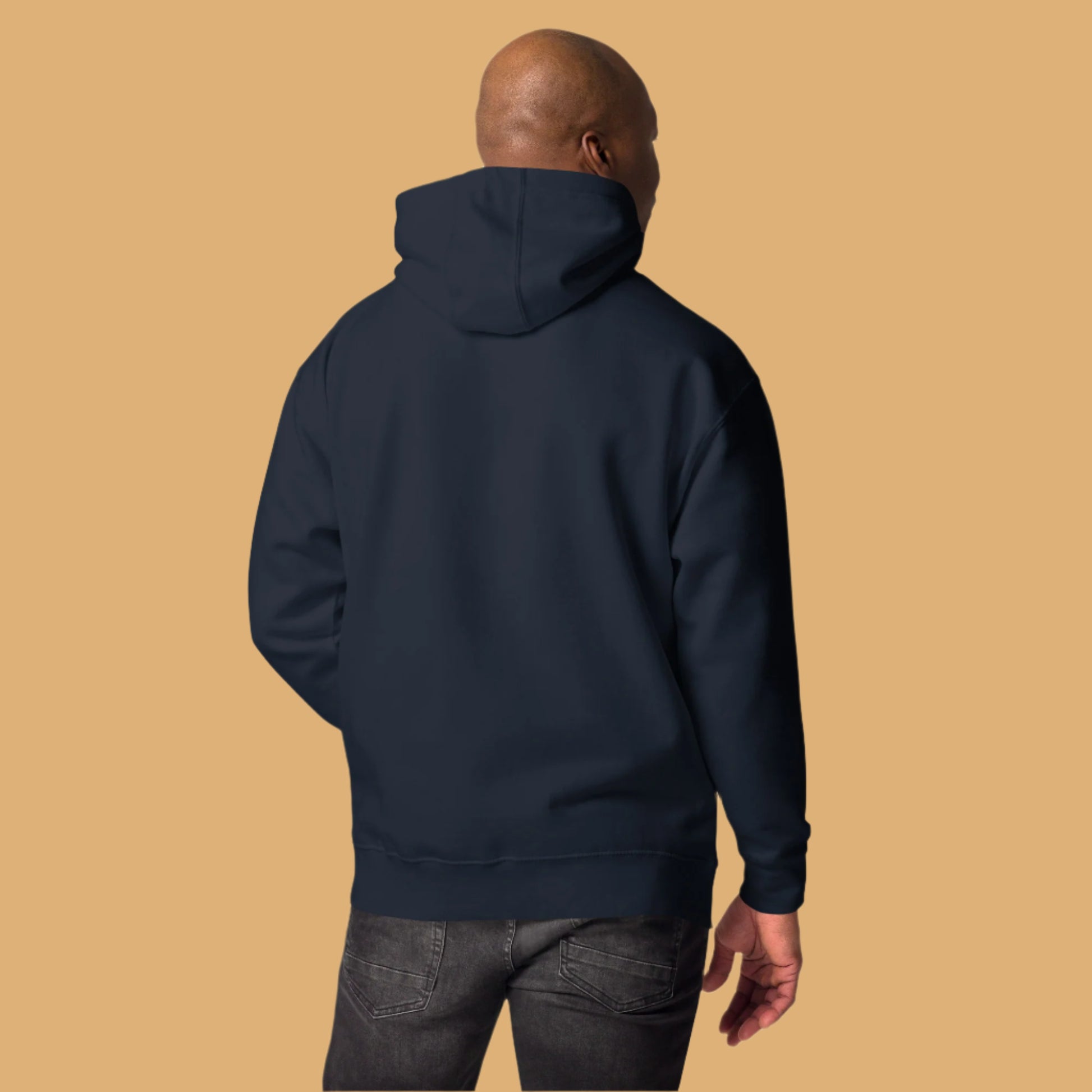 Person wearing a navy blue hoodie from behind on a white background