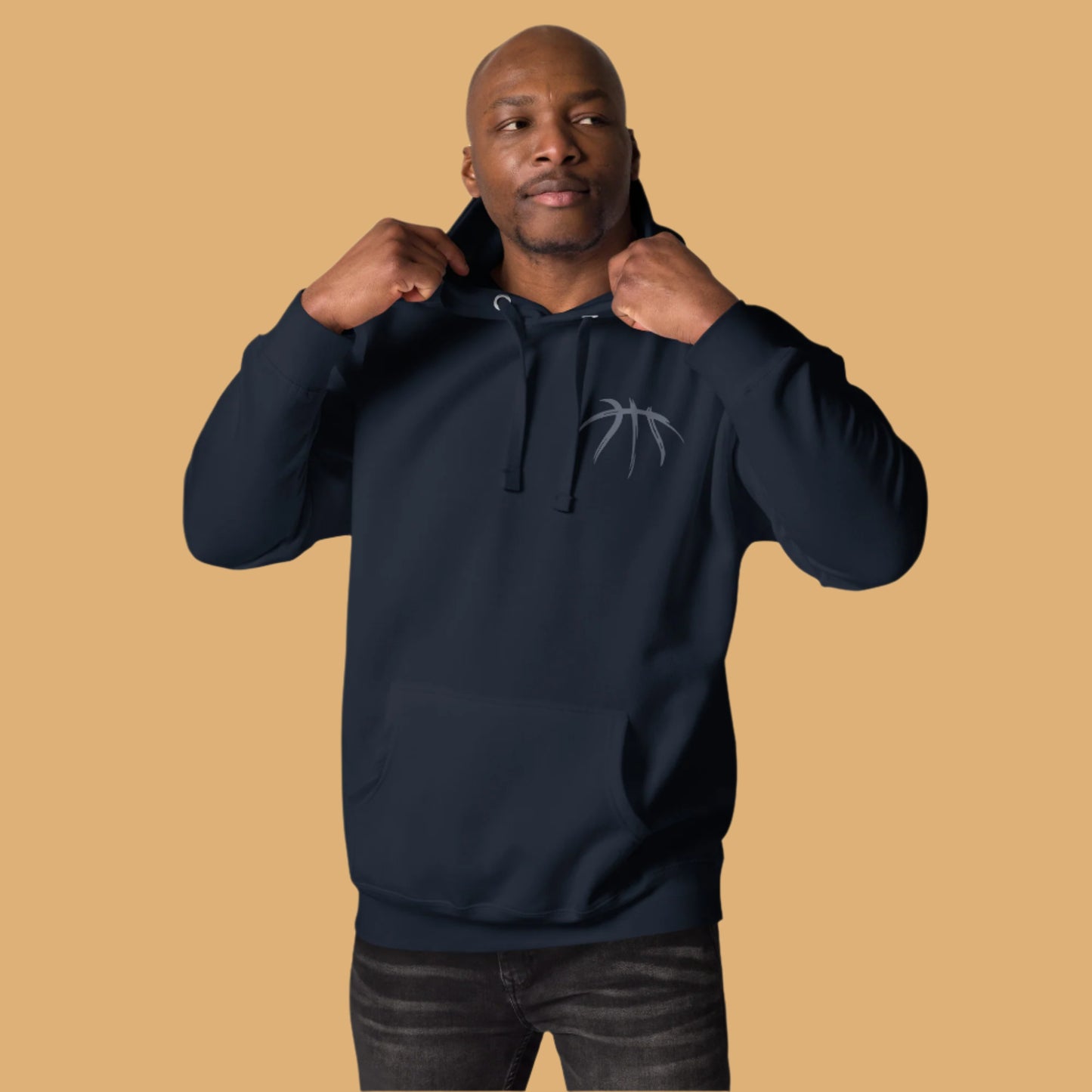 Man wearing a navy blue hoodie with a logo on a white background