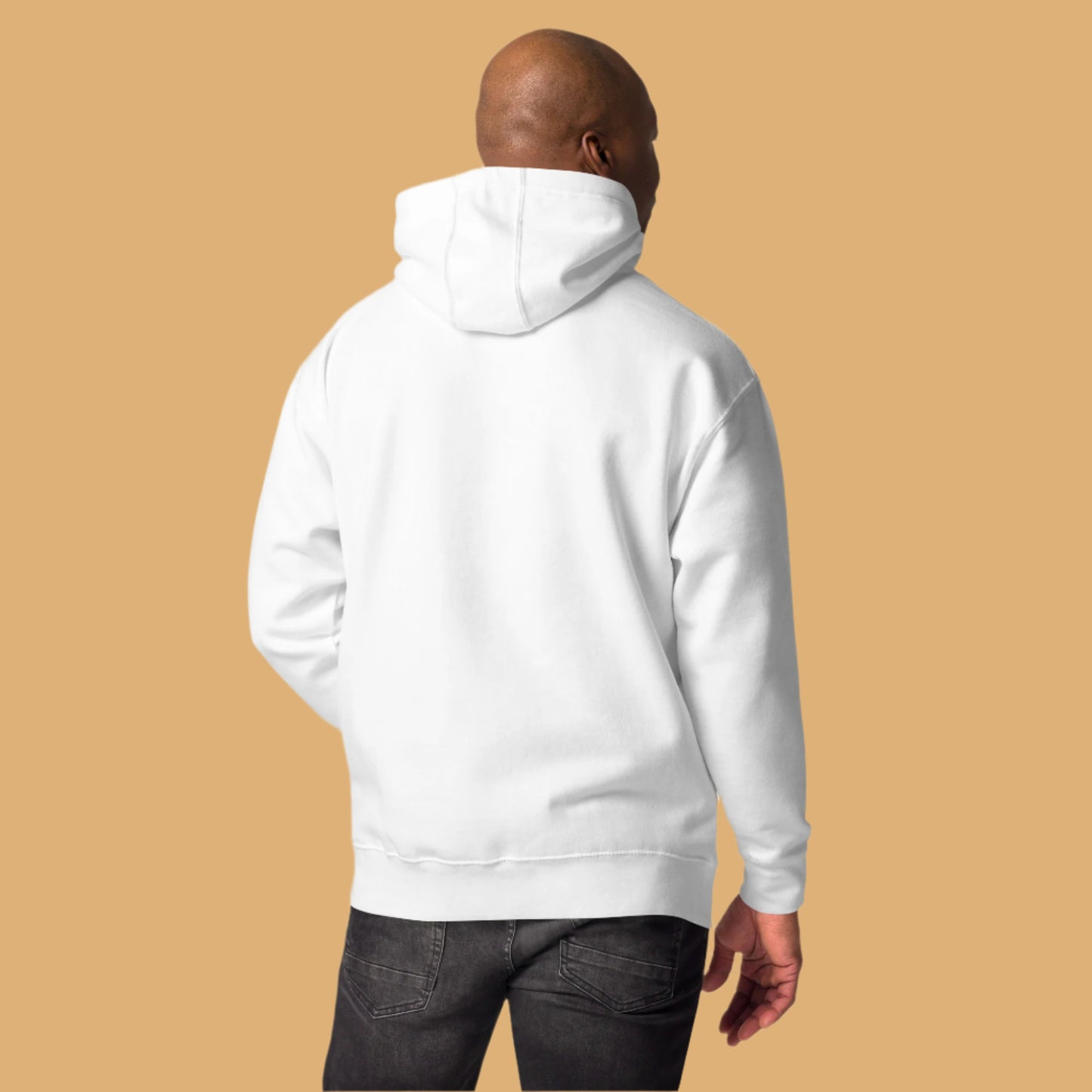 Person wearing a white hoodie on a beige background