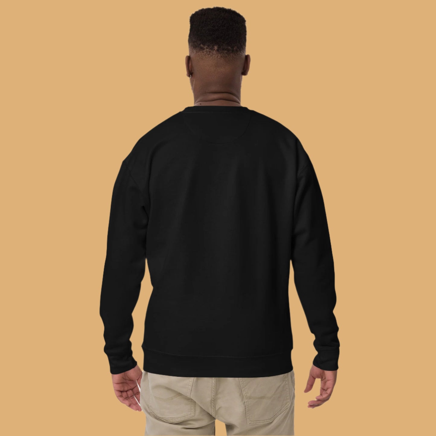 Person wearing a black sweatshirt on a white background