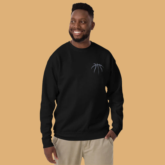 Man wearing a black sweatshirt with a logo on a white background