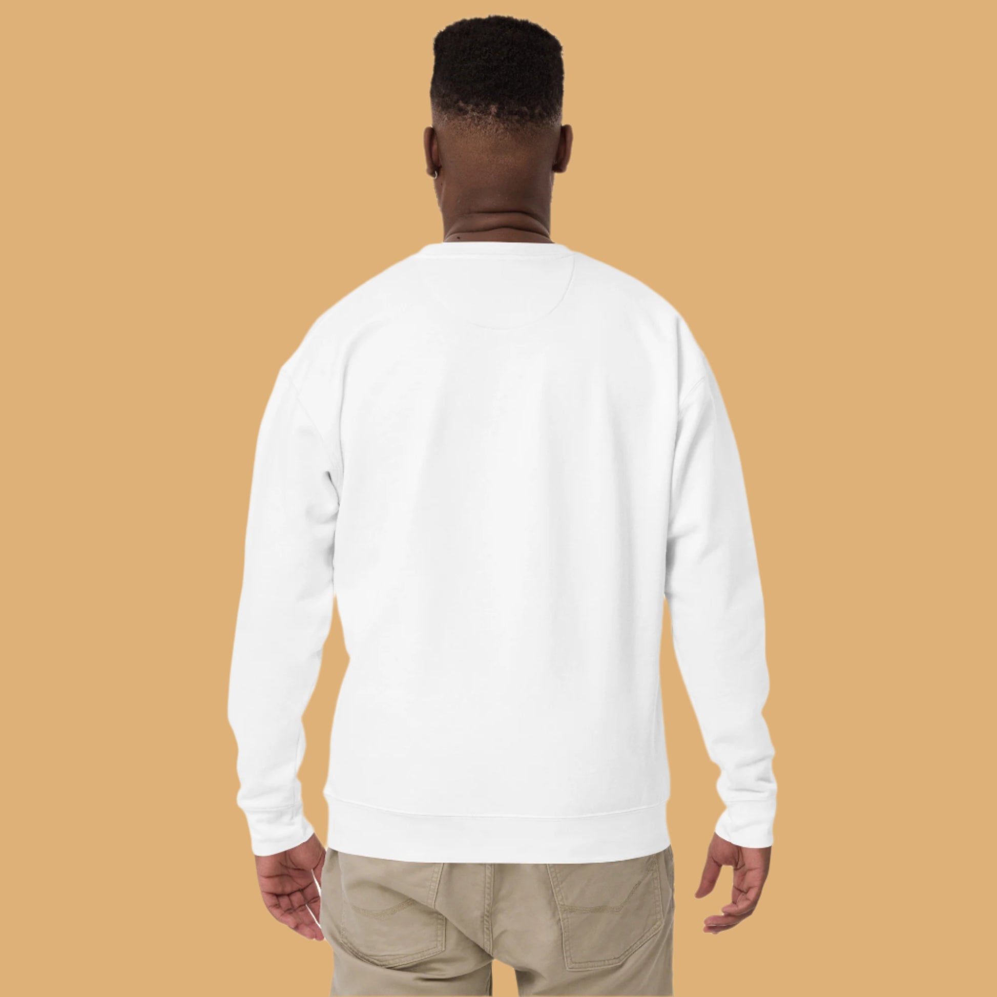 Person wearing a white long-sleeve shirt on a white background