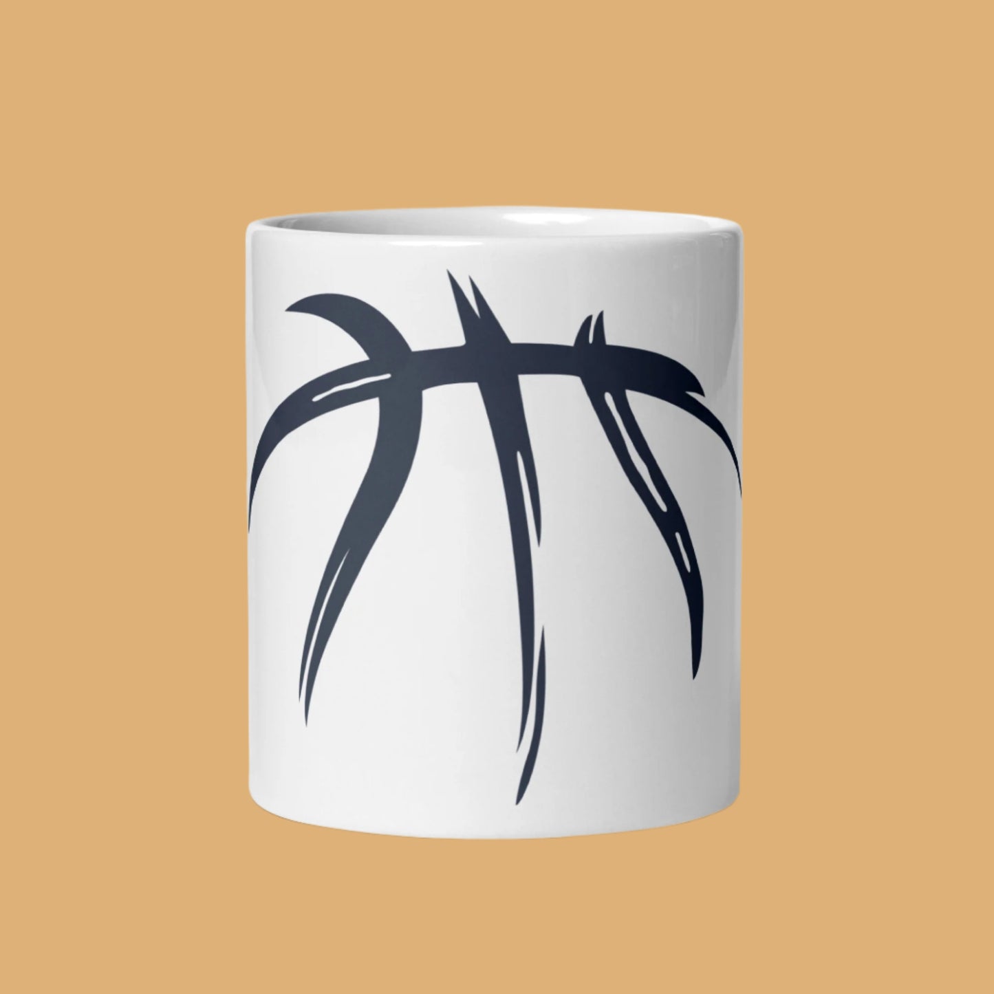 White mug with black abstract design on a beige background
