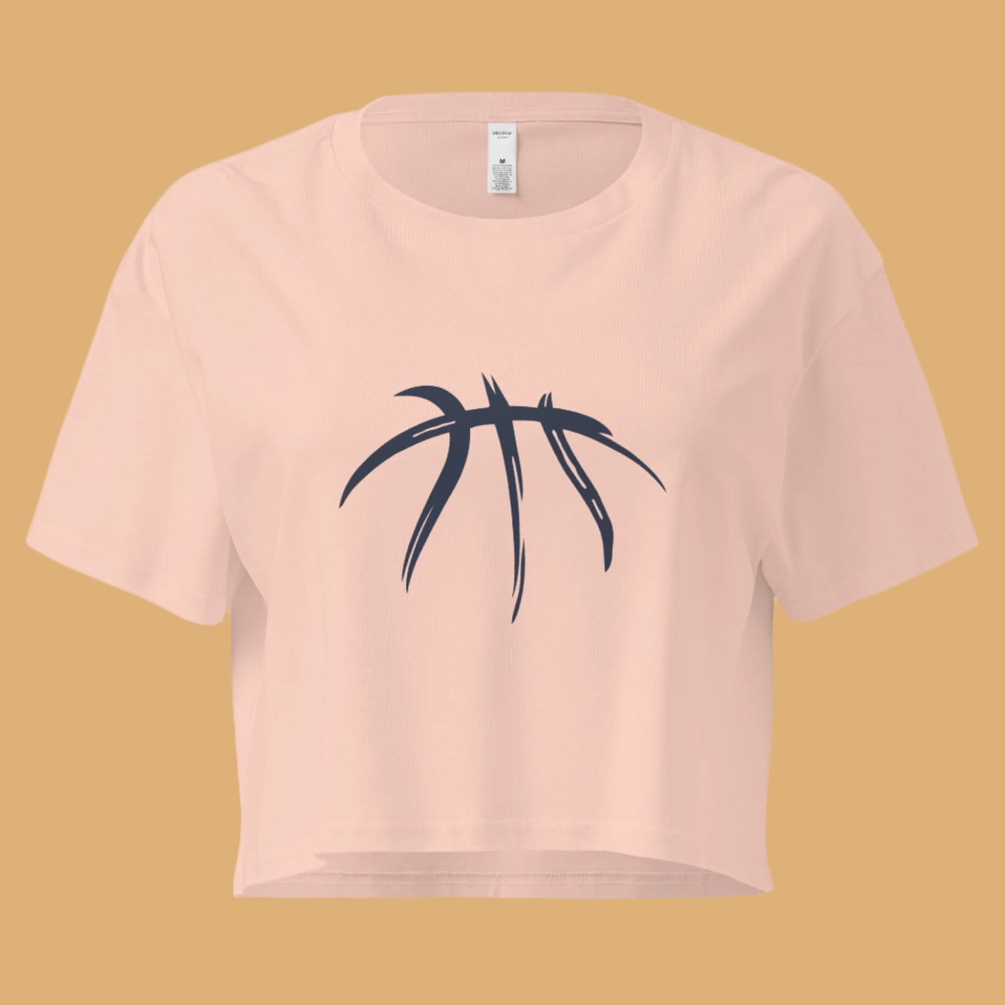 Pink crop top with black leaf design on a white background