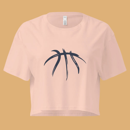 Pink crop top with black leaf design on a white background